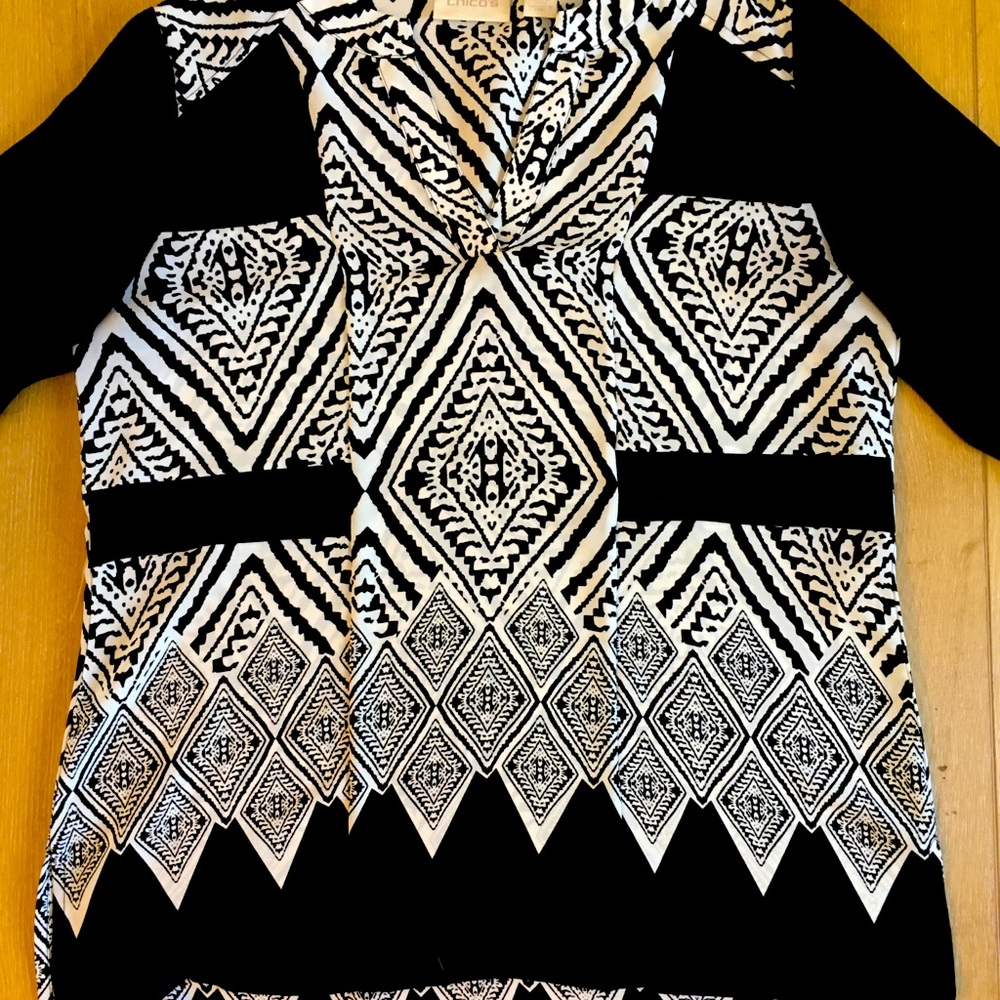 Black and cream pattern tunic blouse.